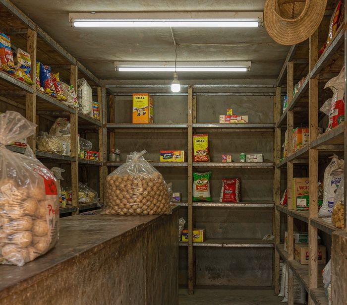 Small rural shop with visible LED lights illuminating shelves and counter — AI-generated illustrative scene